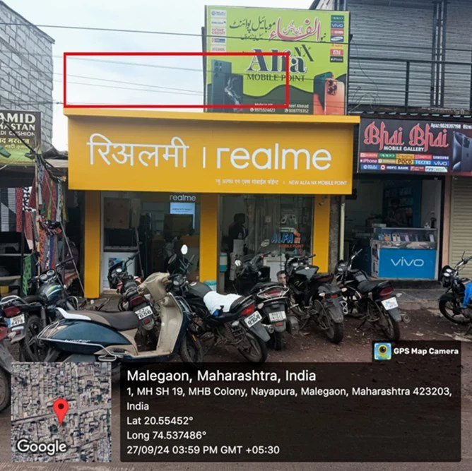 Before — storefront with realme board only, New Alfa NX Mobile Point, Malegaon