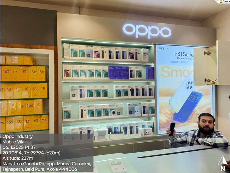 After — OPPO in-shop display wall with backlit logo and shelving, Mobile Vila, Akola